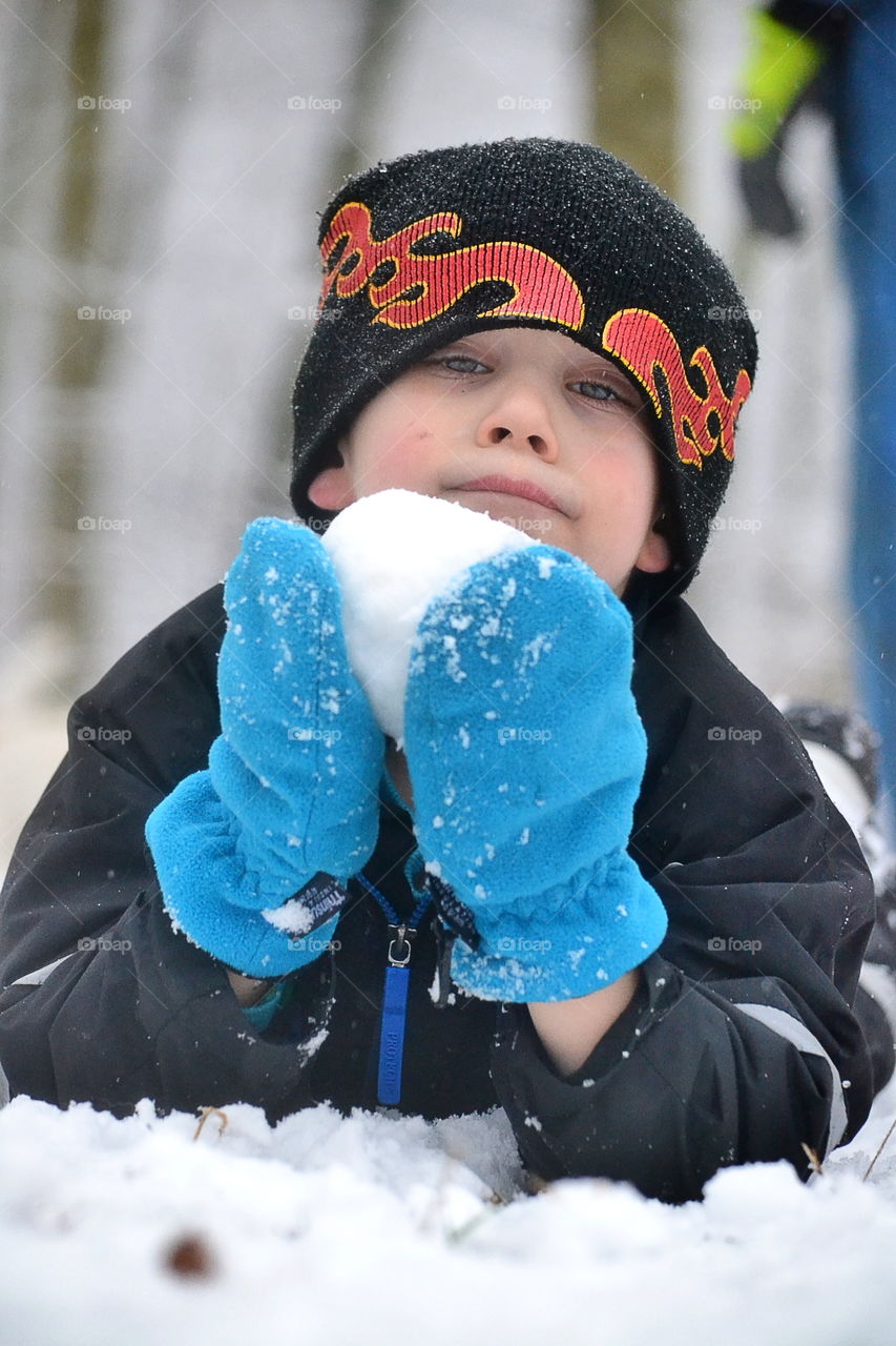 Boy making snowball