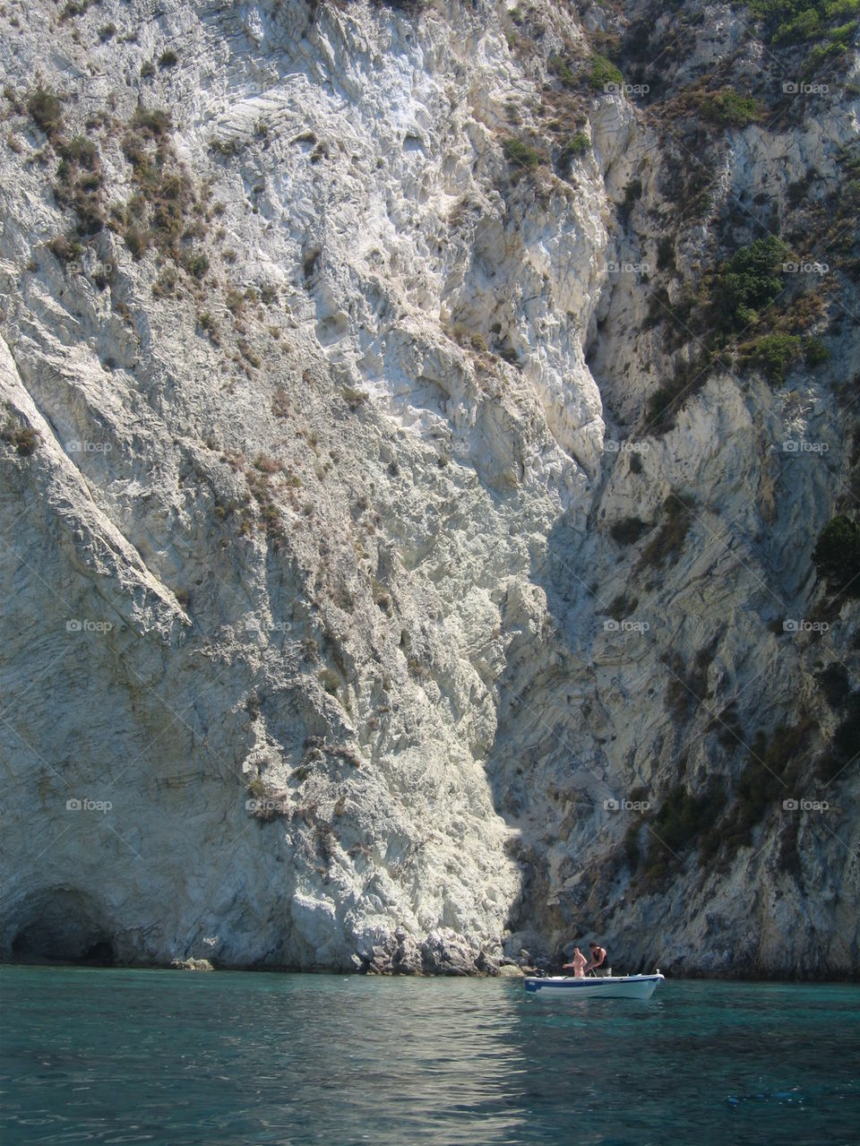 Boat in front of cliffs at Zakinthos island