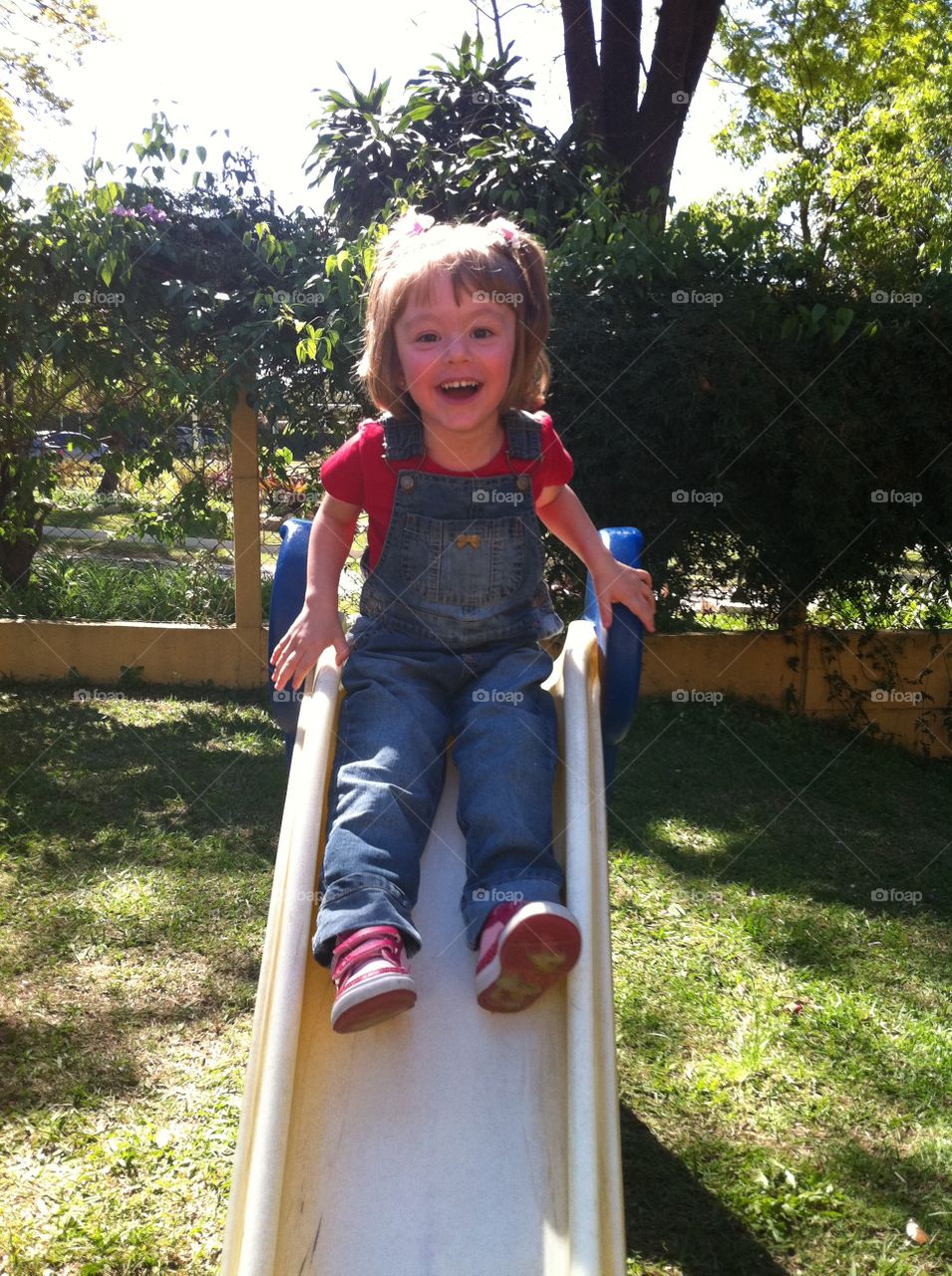 Cute girl playing on slide