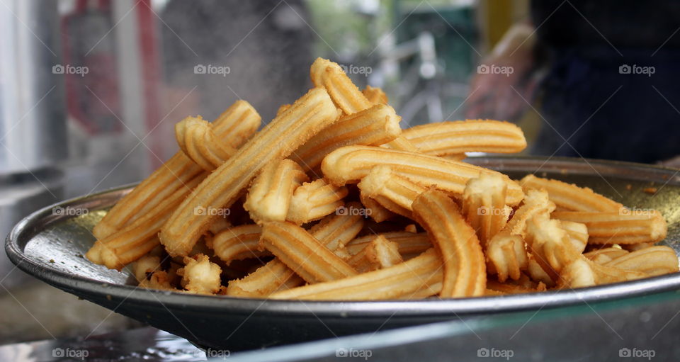 Close-up of churros by the foodtruck