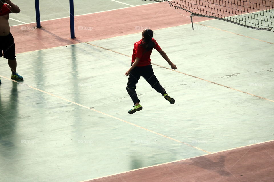 An Athlete Is Playing Volleyball And Jumping on Air .