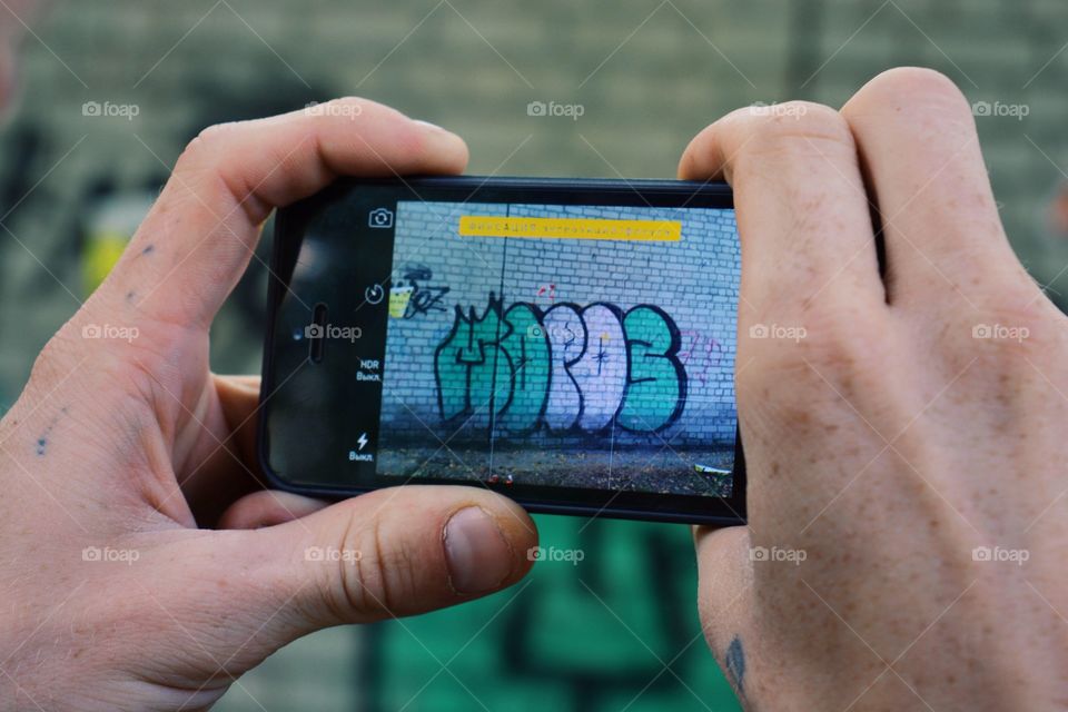 Boy taking photo with smartphone