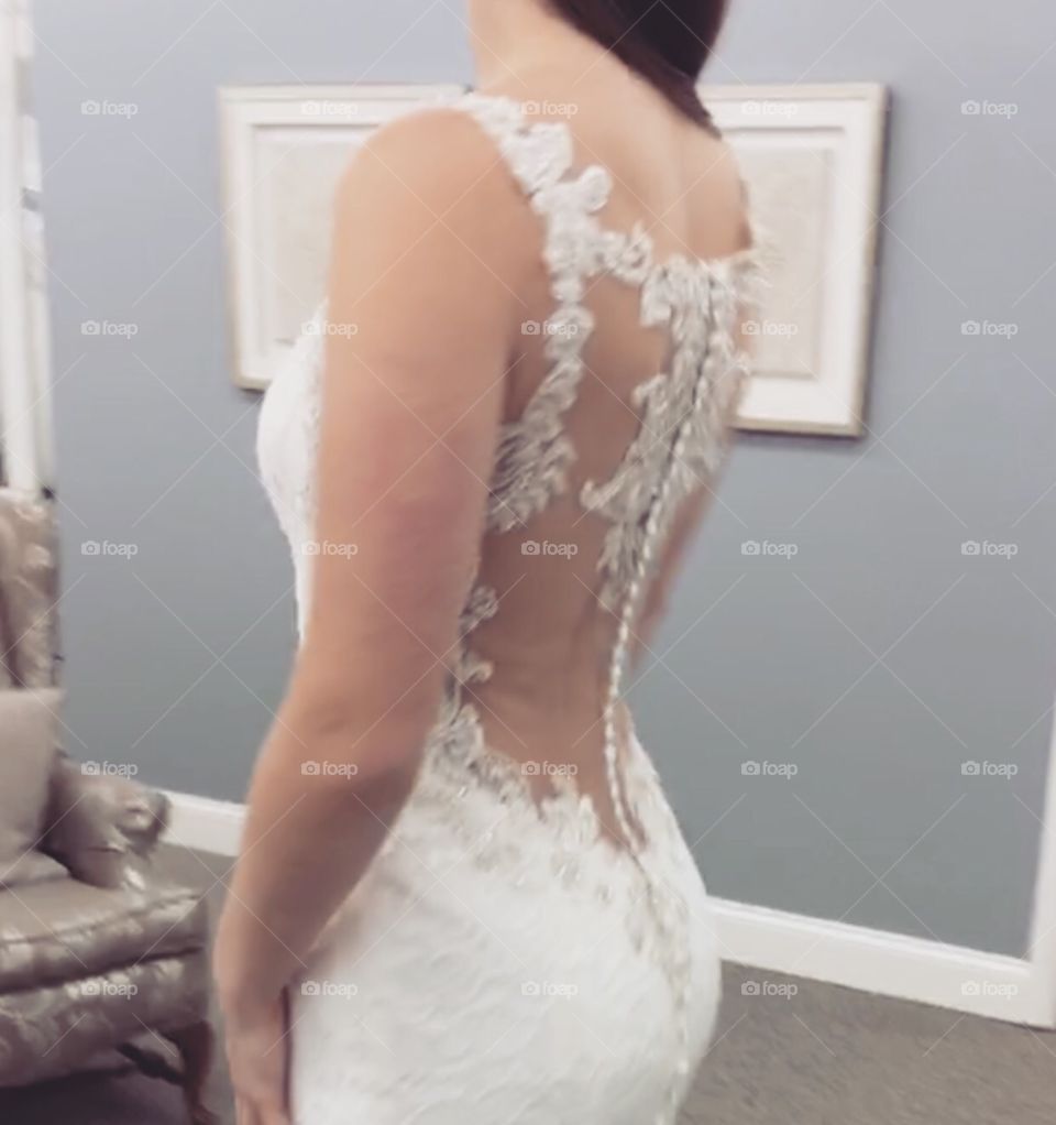 Mesh back of beautiful wedding dress. Covered with beaded lace appliqué 