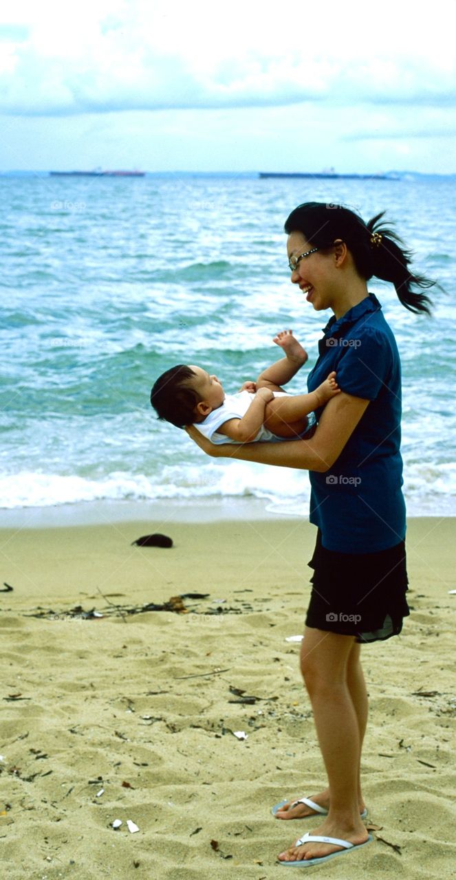 Baby and mum on the beach