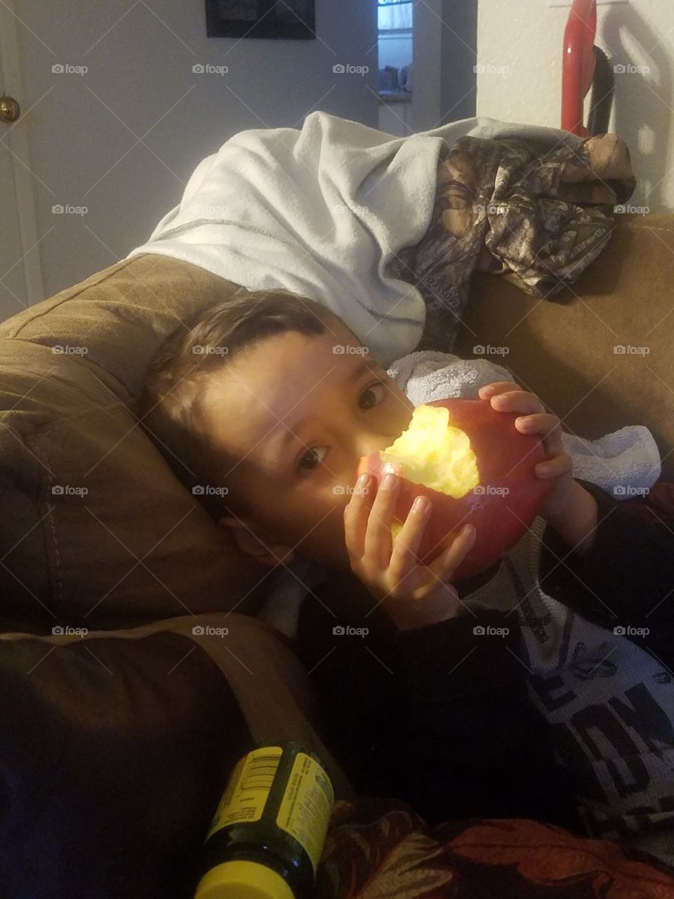 Enjoying an Apple.