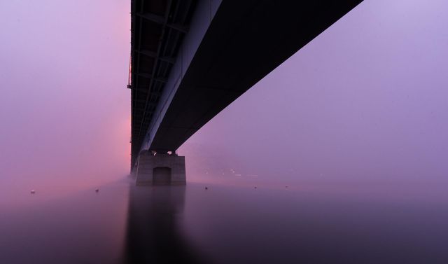 Bridge sitting on a purple cloud