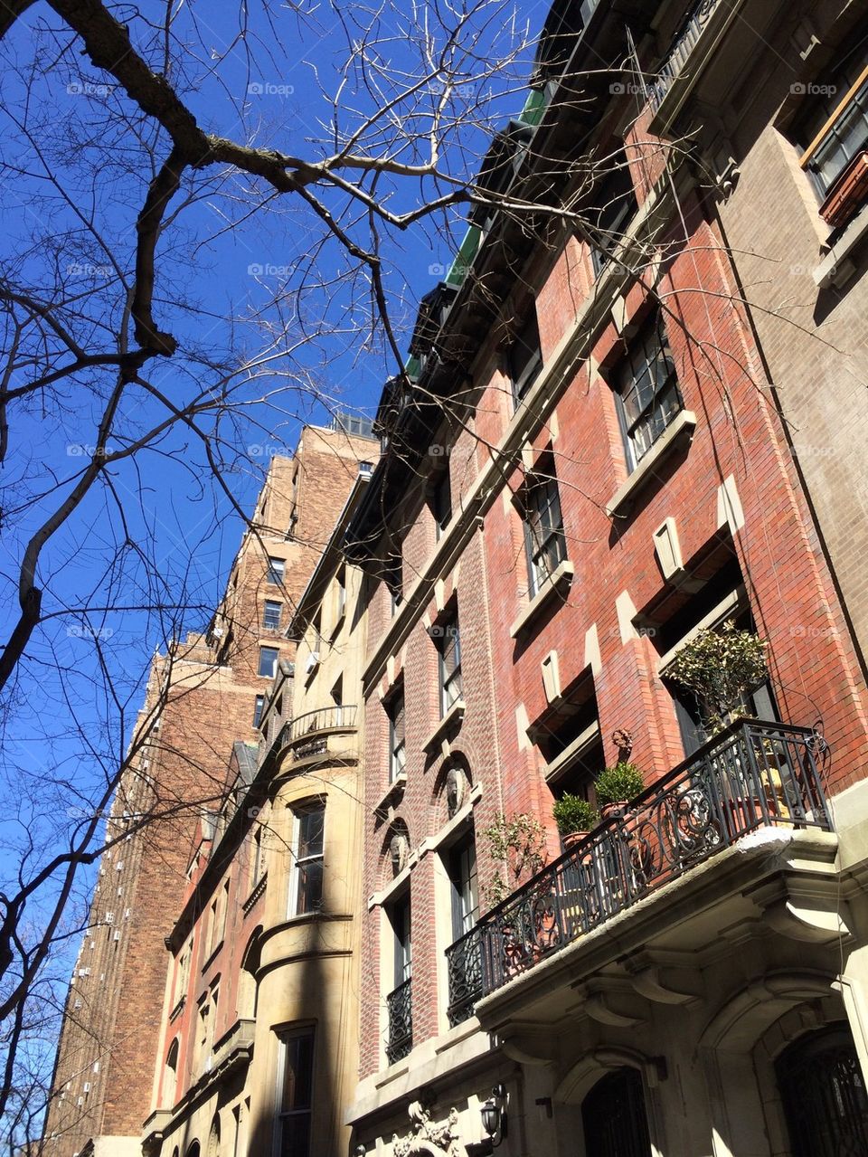 Upper West Side NYC brownstones and blue sky