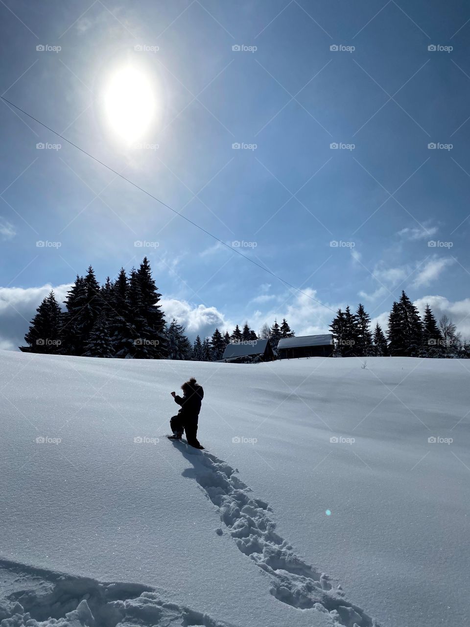 A winter and a little girl in the snow