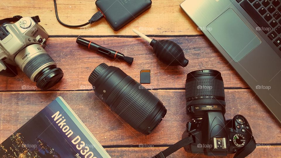 Photography equipment on a desk.