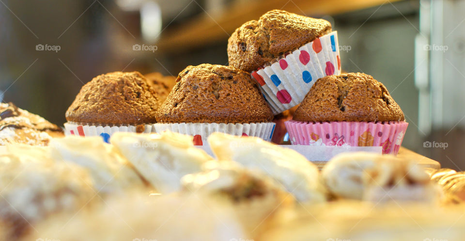 Close up view of muffins displayed on a shop