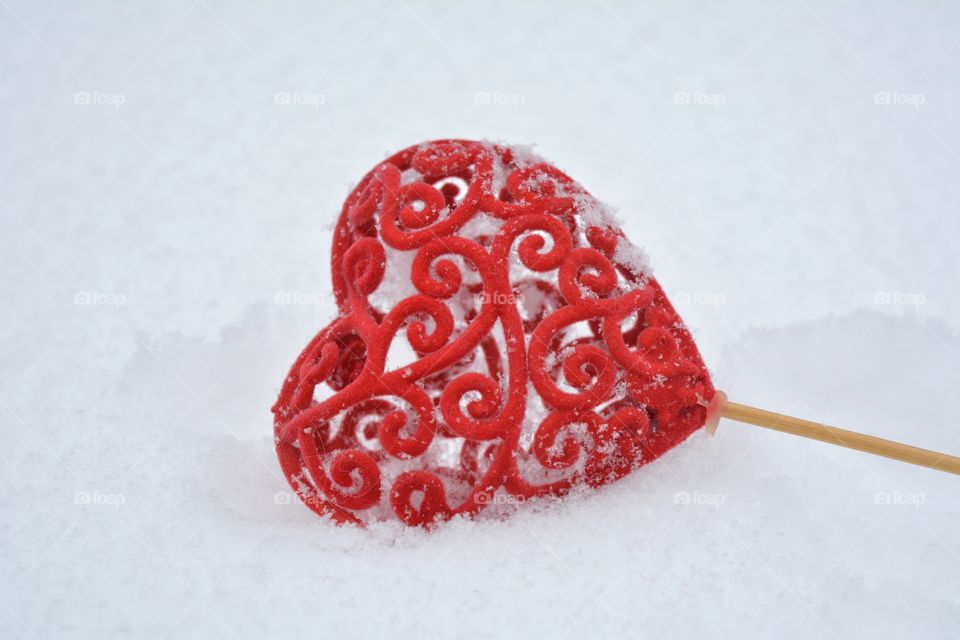red heart on the snow beautiful texture background, love winter
