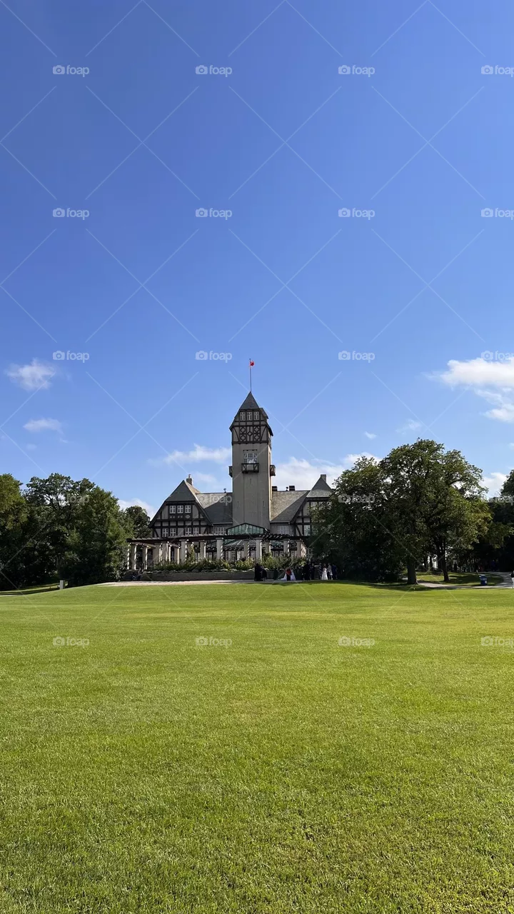 The castle hides inside the garden