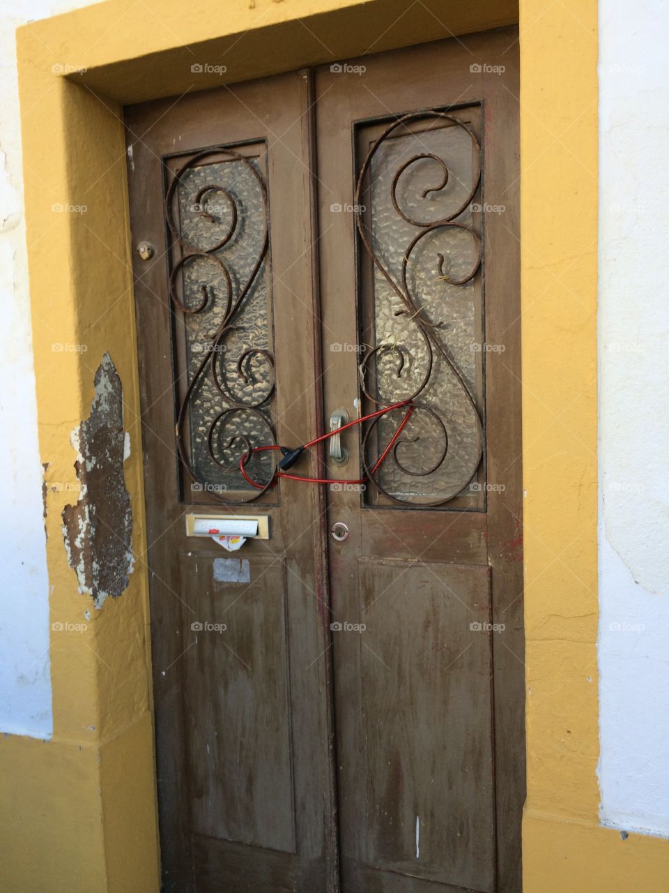 An odd way to lock your door. Found in Lagos, Algarve, Portugal