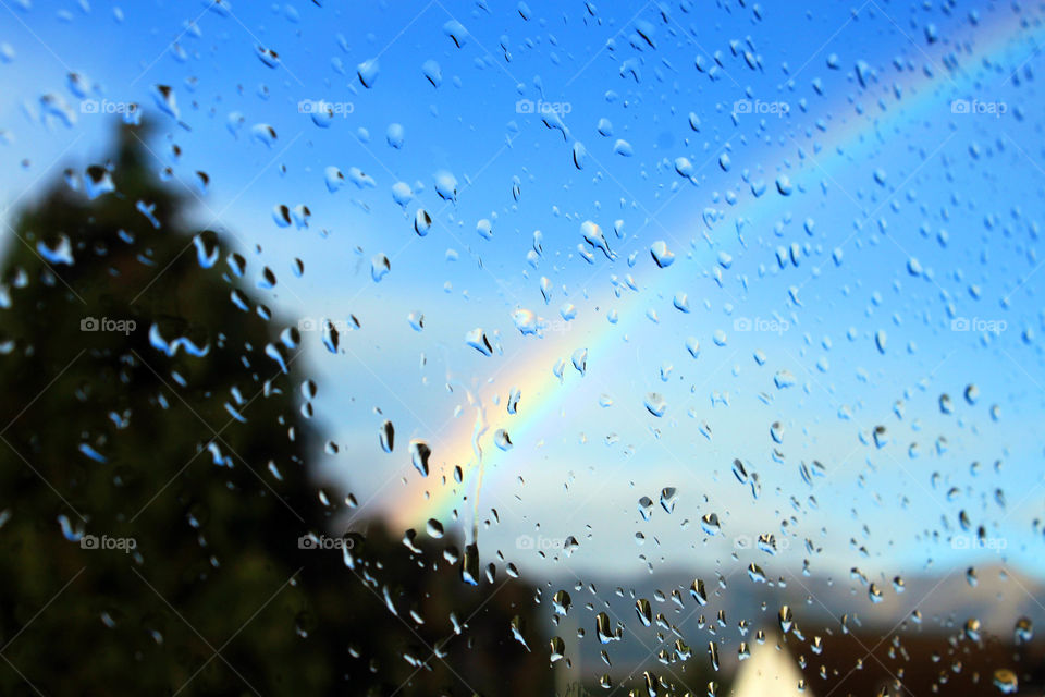 View of a rainbow seen through glass