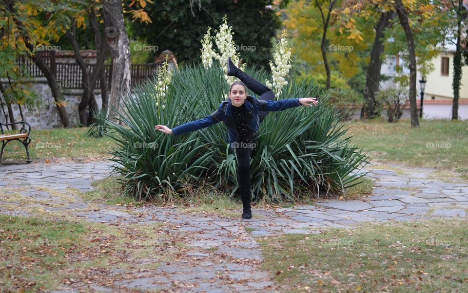 Beautiful Young Girl Dancing Outside in Nature