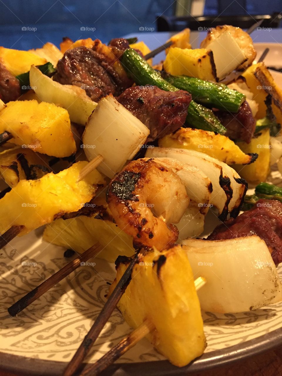 Roasted Pineapple Garlic Shrimp and Beef Kebabs with fresh pineapple, asparagus and white onion