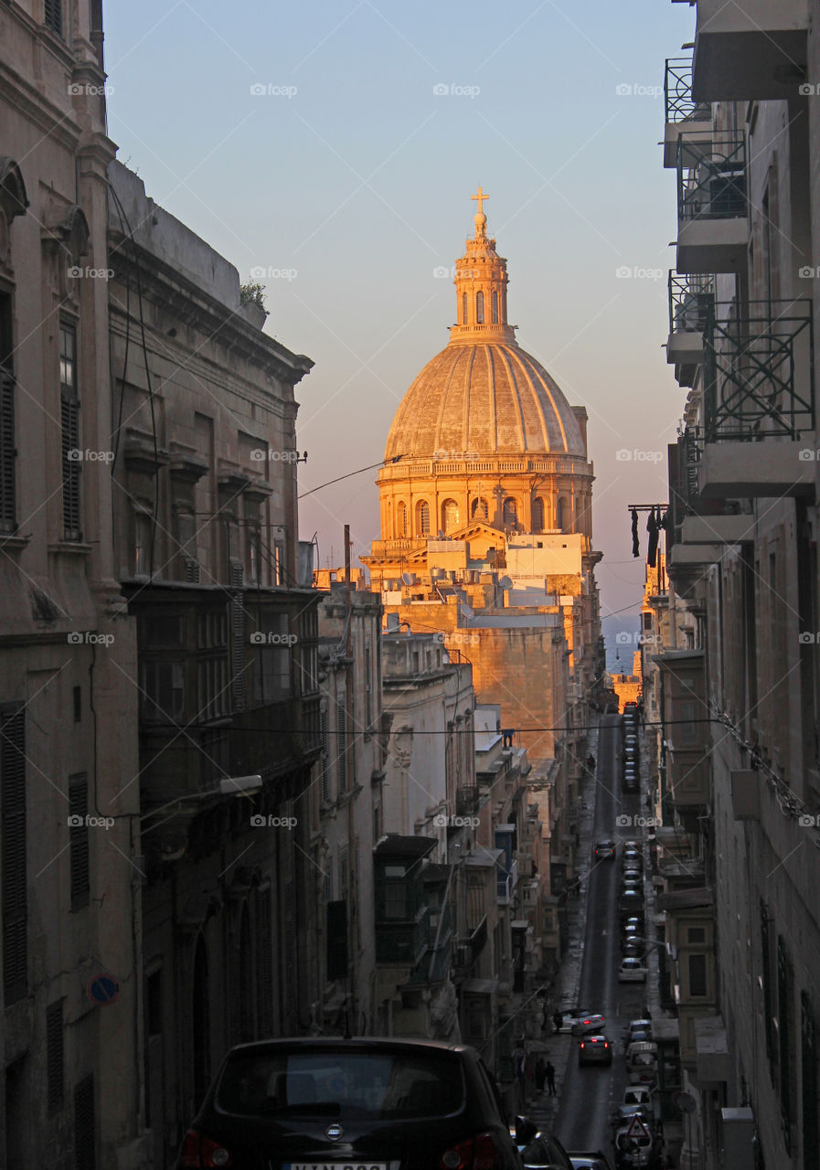 golden sunlight on the dome of a church in Valletta, Malta