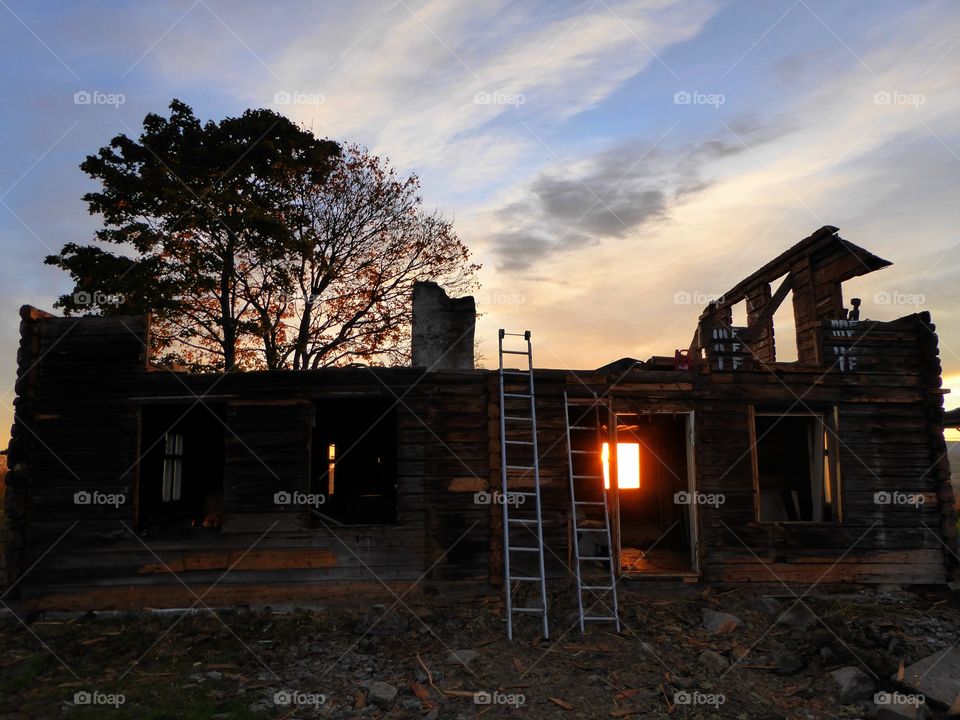 House with a glow. A more than 150 years old timberhouse coming down.