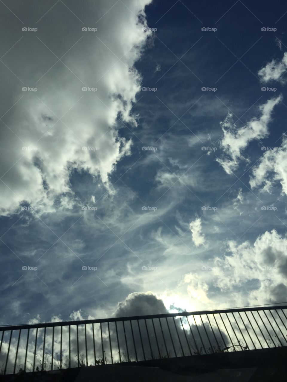 Cloudy sky and hand-rail