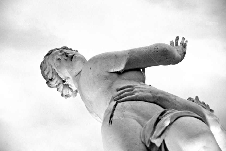 statue of a person in a garden