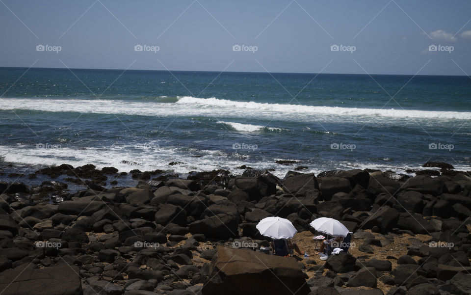 Relaxing under Umbrellas Beachside