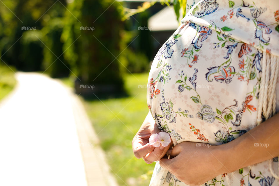 Beautiful pregnant girl . Beautiful pregnant girl and flowers