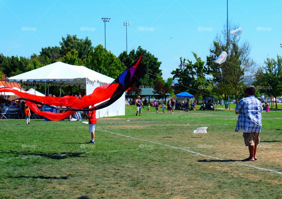 Man flying kite at a festival