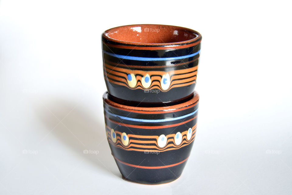 Ceramic cups on white background