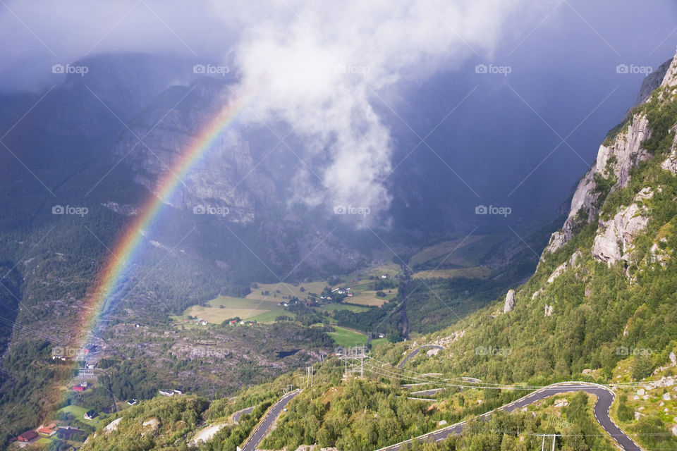 Rainbow over a valley Lysebotn. Norway