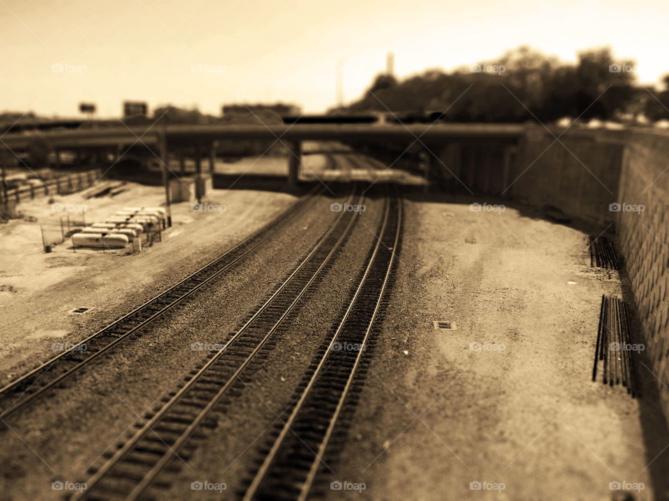 Sepia Railroad Tracks, Kansas City. I photographed these railroad tracks which run through Kansas City. I added a sepia tone and tilt shift effect.