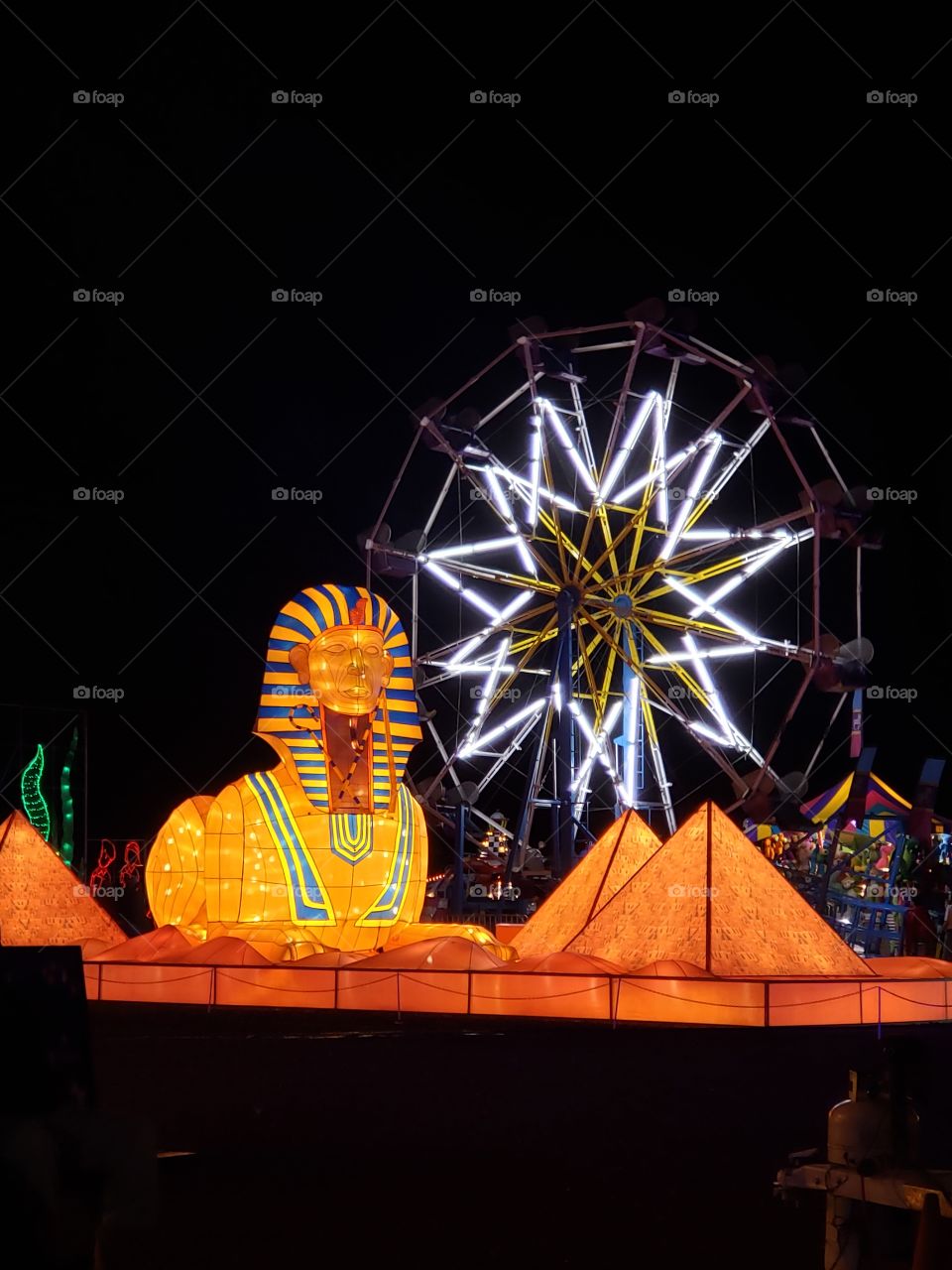 the pyramids from Egypt with the ferris wheel in the background