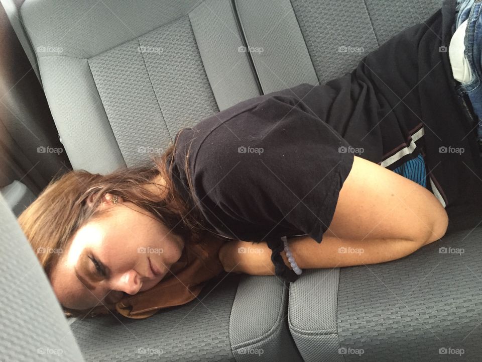 Woman sleeping in car