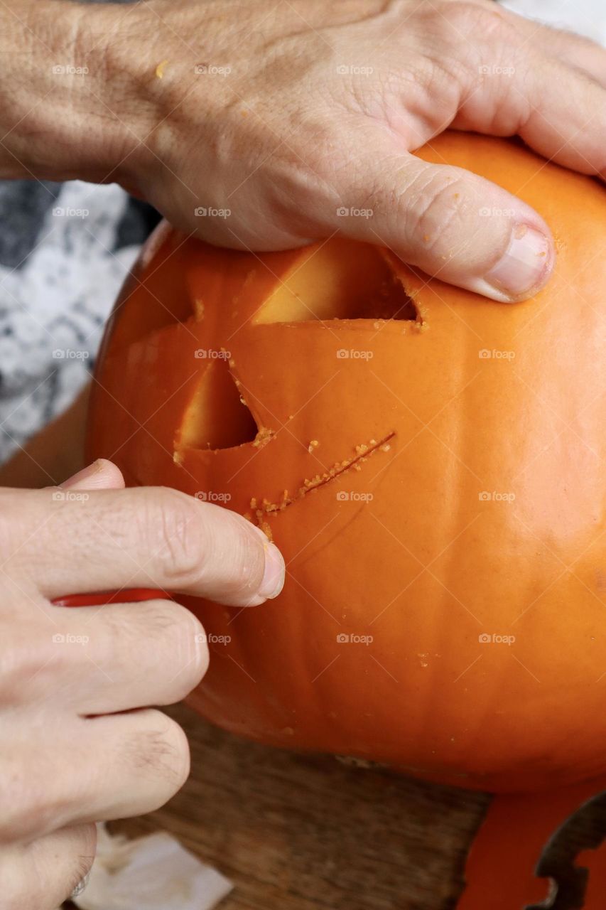 Carving Halloween pumpkin 