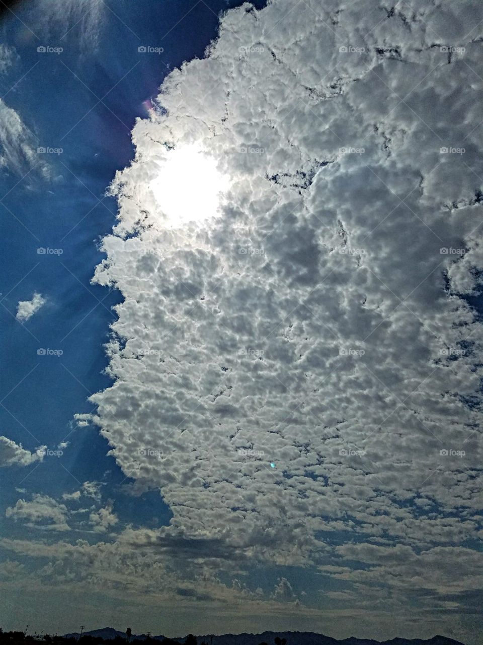 Sun breaking through the clouds in the desert!