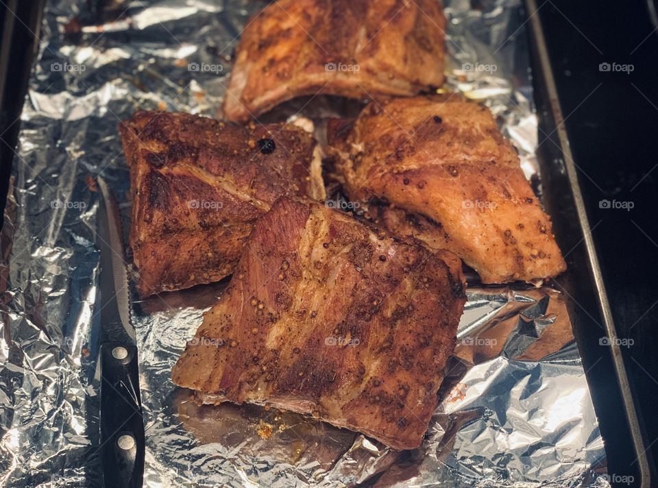 Baby back ribs prepared in an Instant Pot pressure cooker and finished off in an oven. Cutco brand knife on the left 