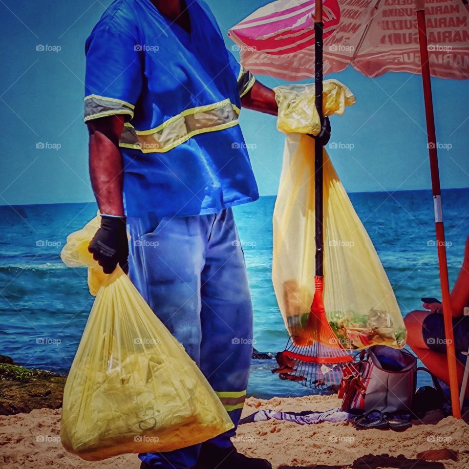 This worker on a beautiful sunny day, while many are resting, he is working for the environment.