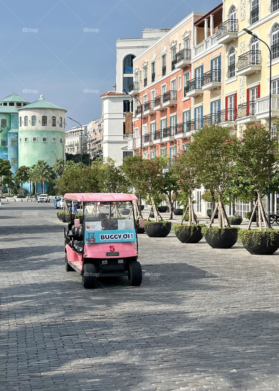 Street photography. Sunset Town, Phu Quoc, Vietnam. Pink buggy. City view. Love travel.