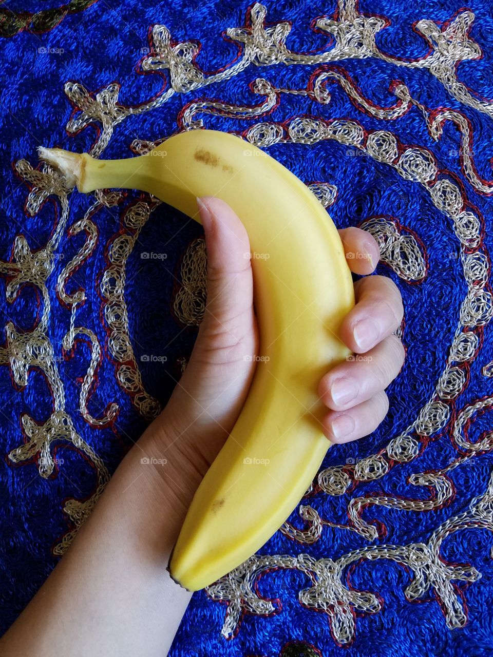 Holding banana