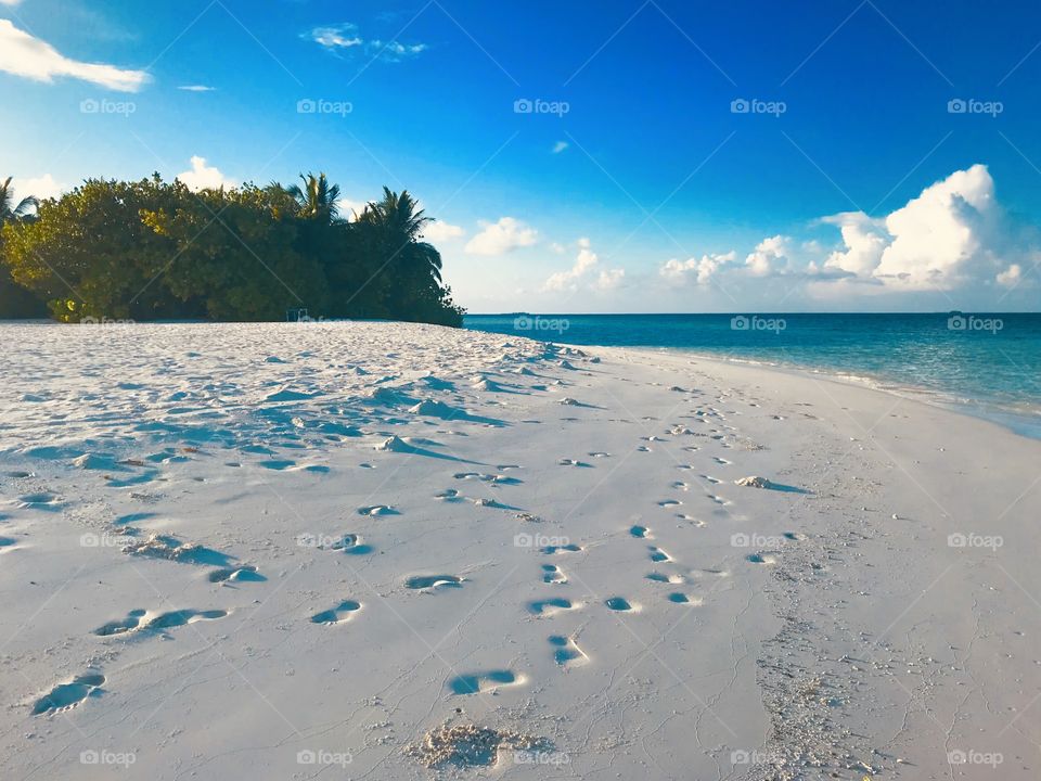 A white Sandy beach and turquoise sea
