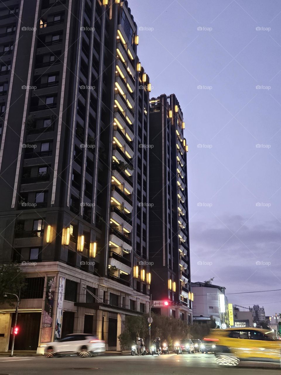 Night shot of buildings and cars at intersection