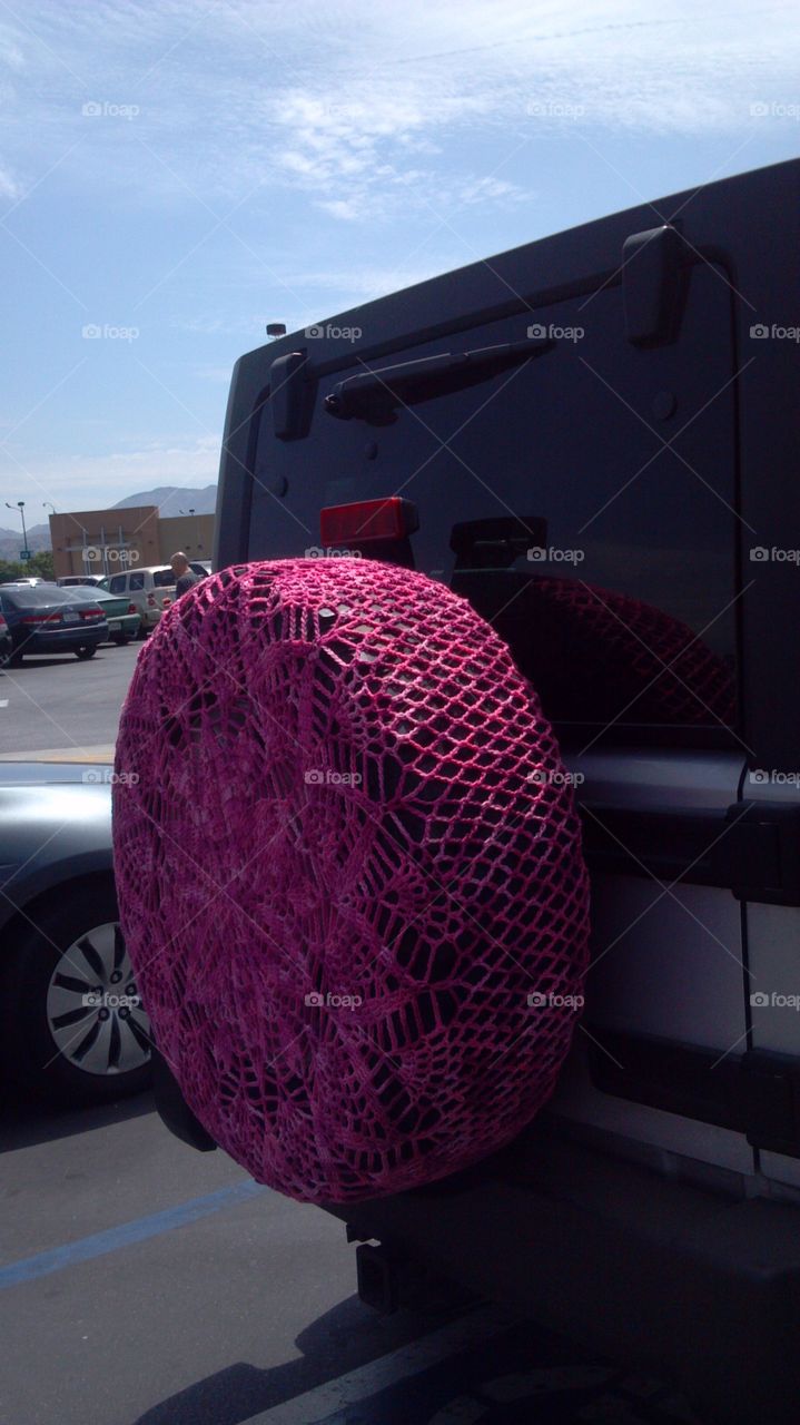 Crochet spare tire cover. Someone crocheted a pink spare tire cover for their Jeep Wrangler -weird!