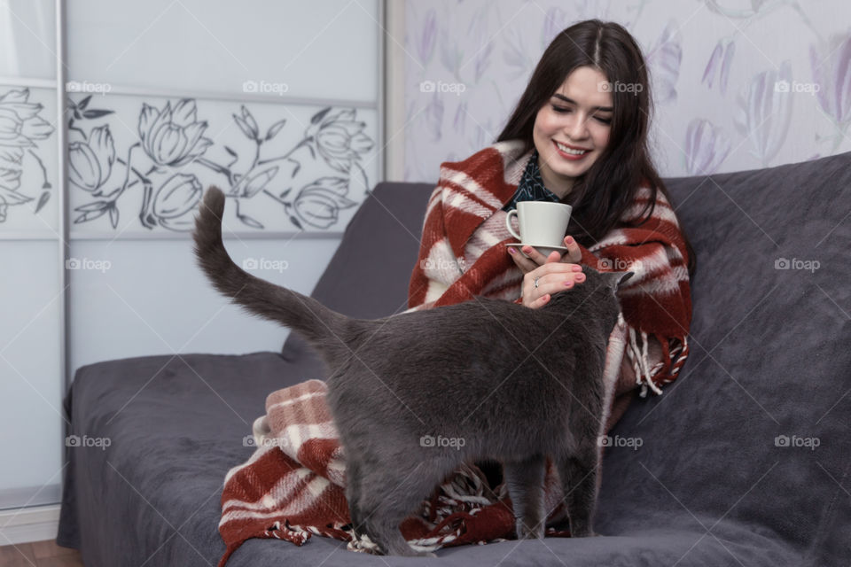 girl with cat in bedroom