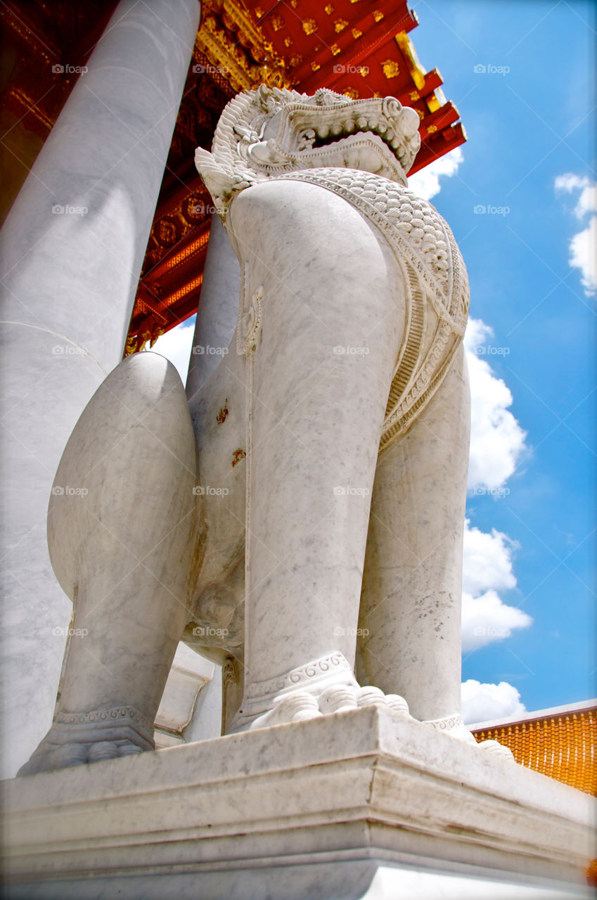 Stone lion in front of temple