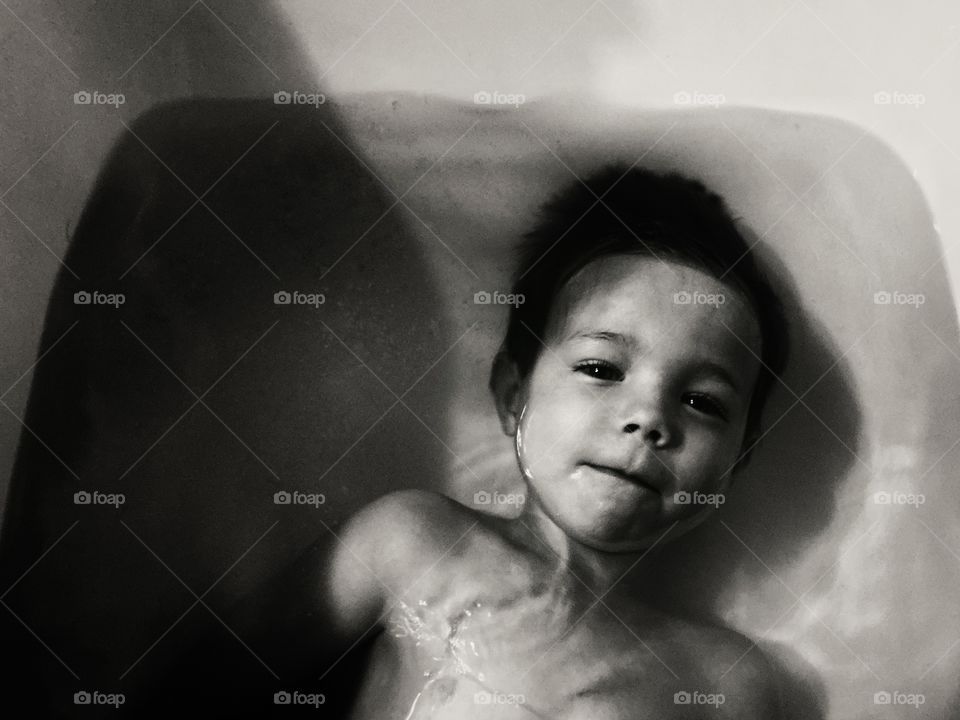 Shadowy bath time for young child