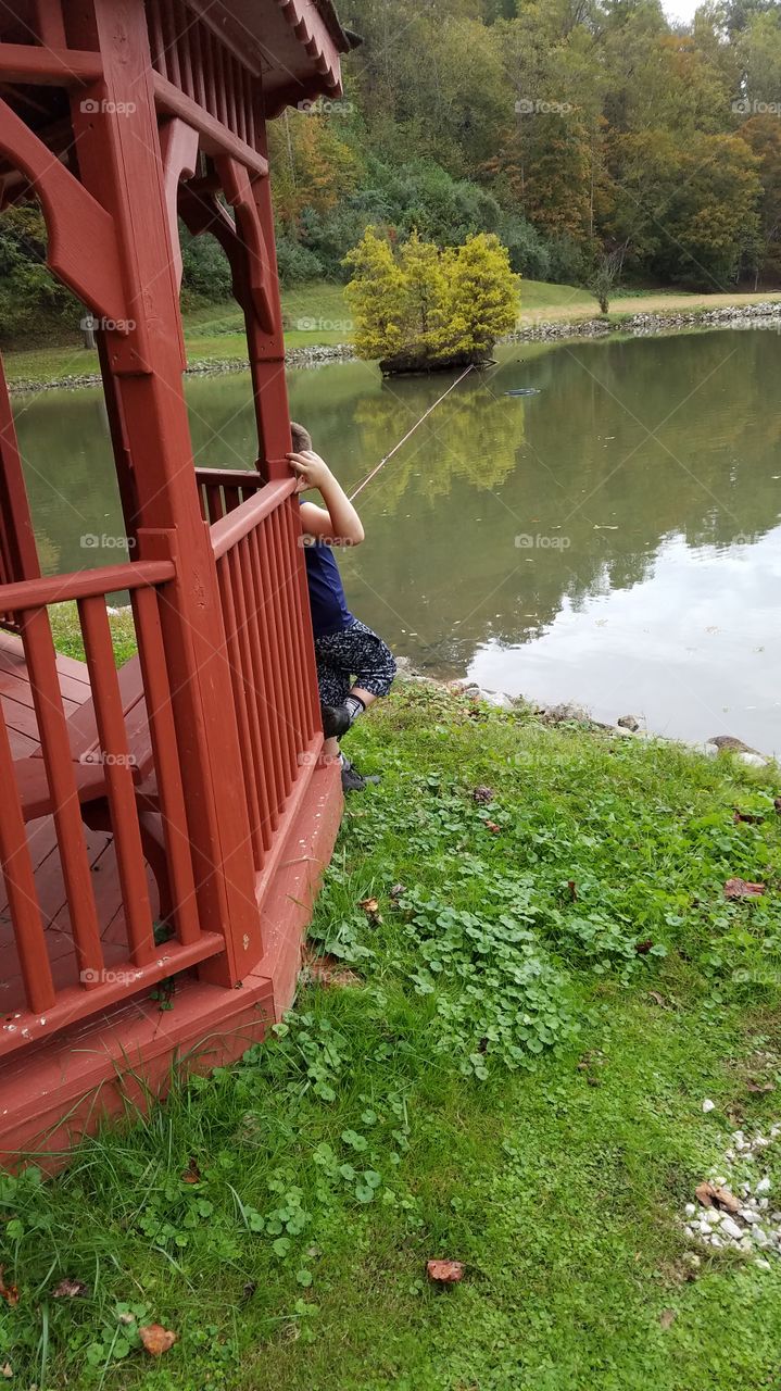 my son fishing in pond