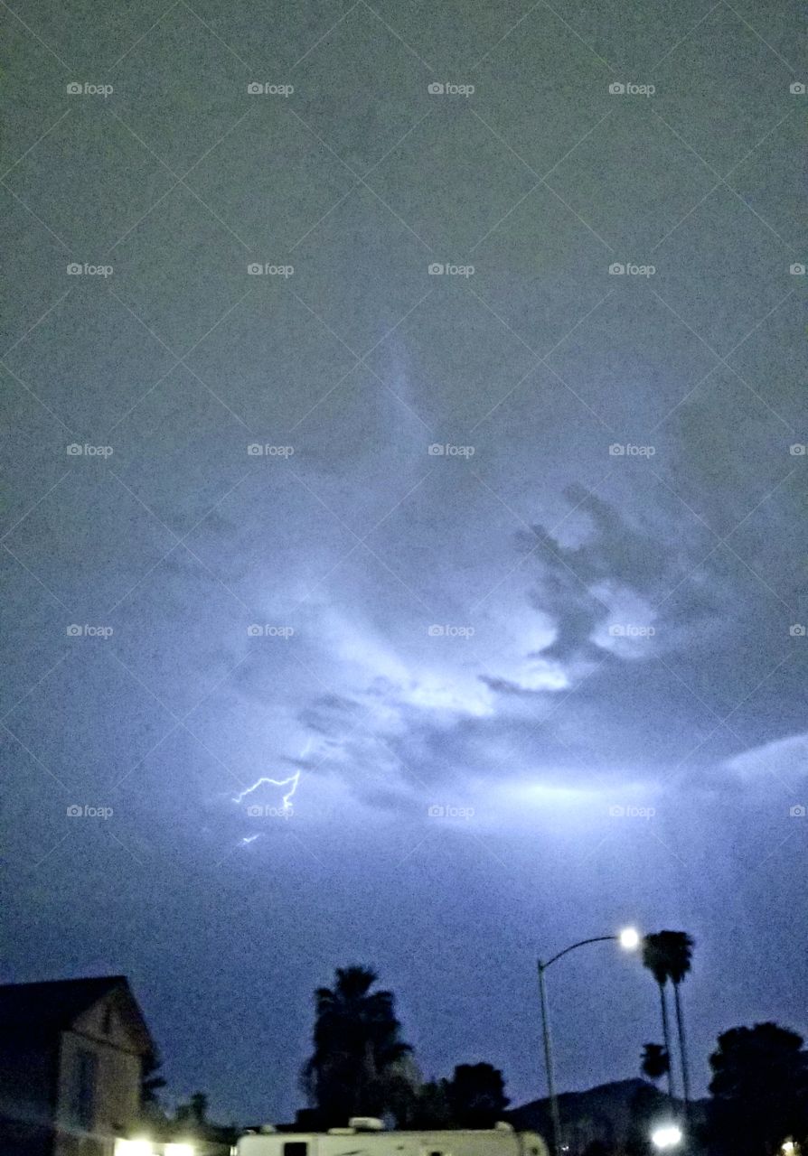 Thunderstorm with lightning in Phoenix, AZ. is a crowd-drawing event.