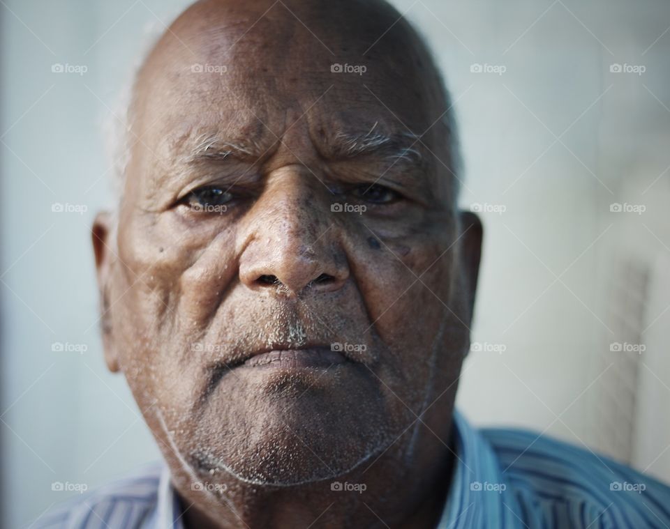 Sharing portrait of Mr. Ram Dev Gupta, age 84. His favorite quote is "life is an echo it comes back to you do good to others goodwill comes back to you".  

He is a legend in kanpur and for few he is worship worthy. Reason is when British left india, he was head of public services for employment, his job was to ensure people who don't have a job and unemployed get it rightful and paid for well being of their family. He had gone beyond his limits for getting job and making people enabled having right job and employment. His unbiased and warm hearted nature made him favorite and loved by all kind of person in society and city. 

Still at age of 84, he is most confident and most articulate person I have ever met. He loves animals and is spiritually devoted. 

Model release available on request. 