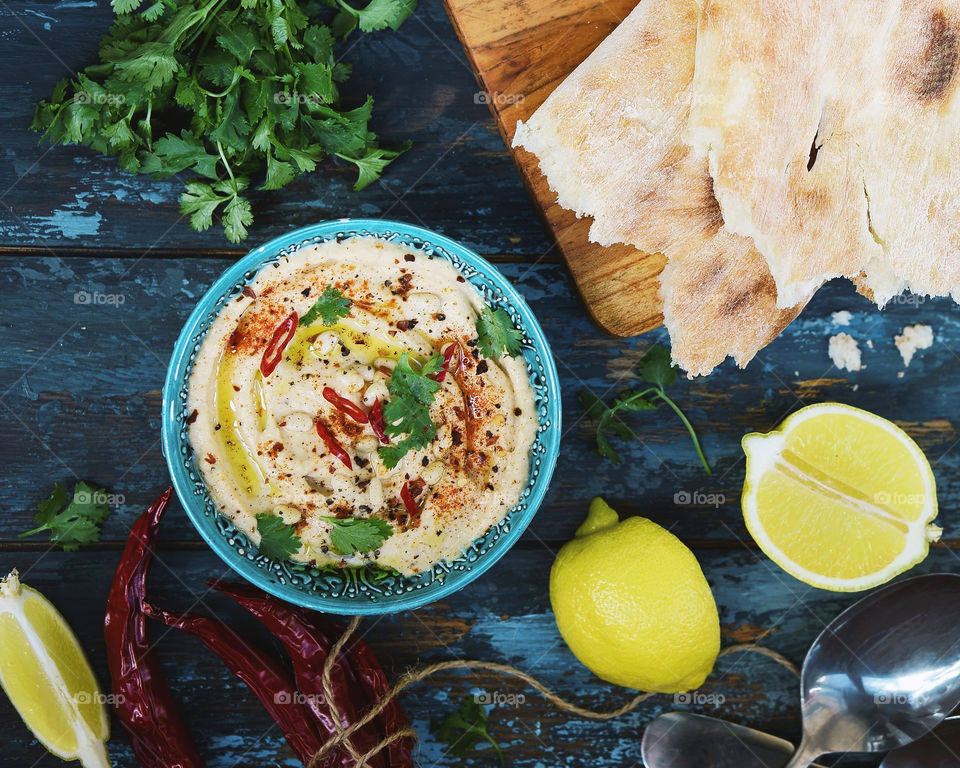 homemade hummus with bread, overhead view