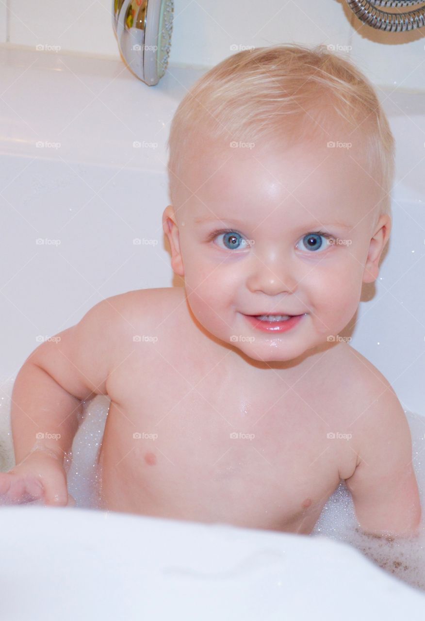 Baby playing in bath