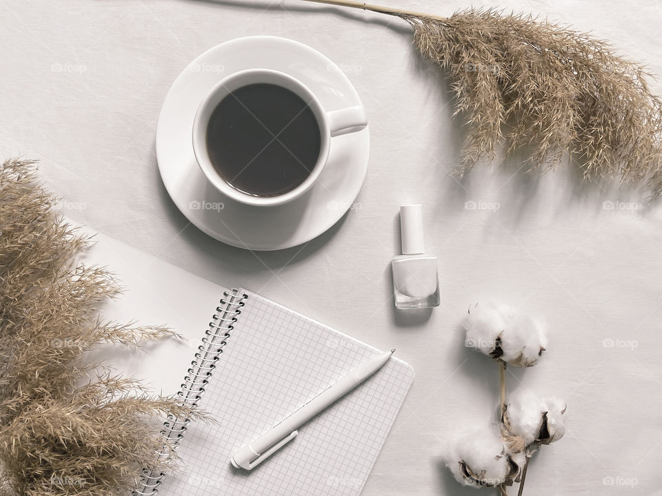 White office supplies on white desktop 